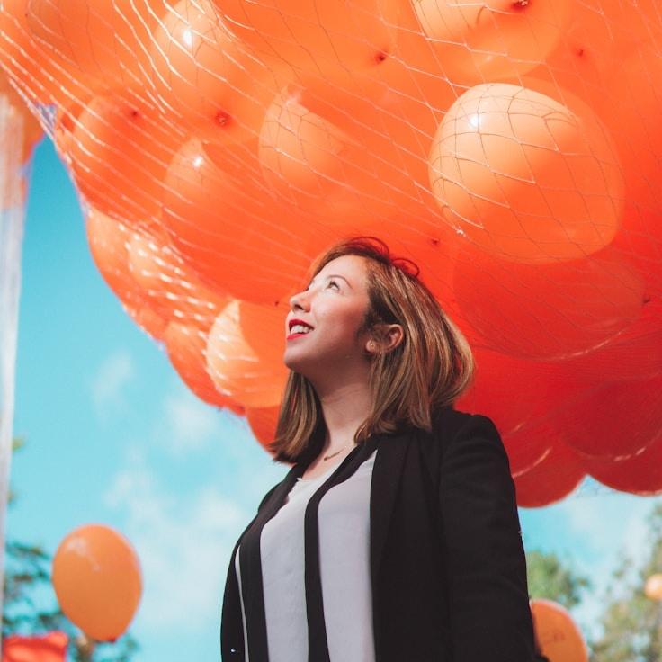 A. Noor, Lead Design Curator at Maple Bloom Haven, reviewing corporate floral arrangements